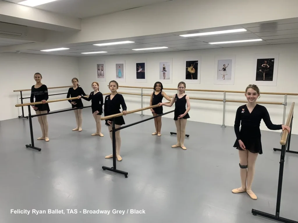Ballet students at portable STM barres on grey Broadway vinyl