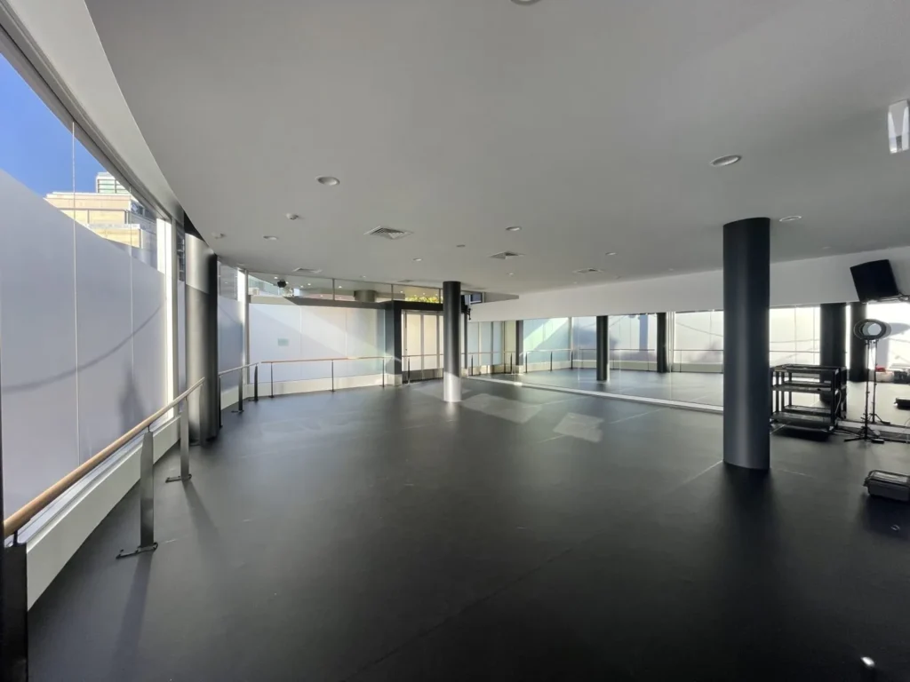 Large dance studio with STM sprung floor, grey dance vinyl and full-height mirrors
