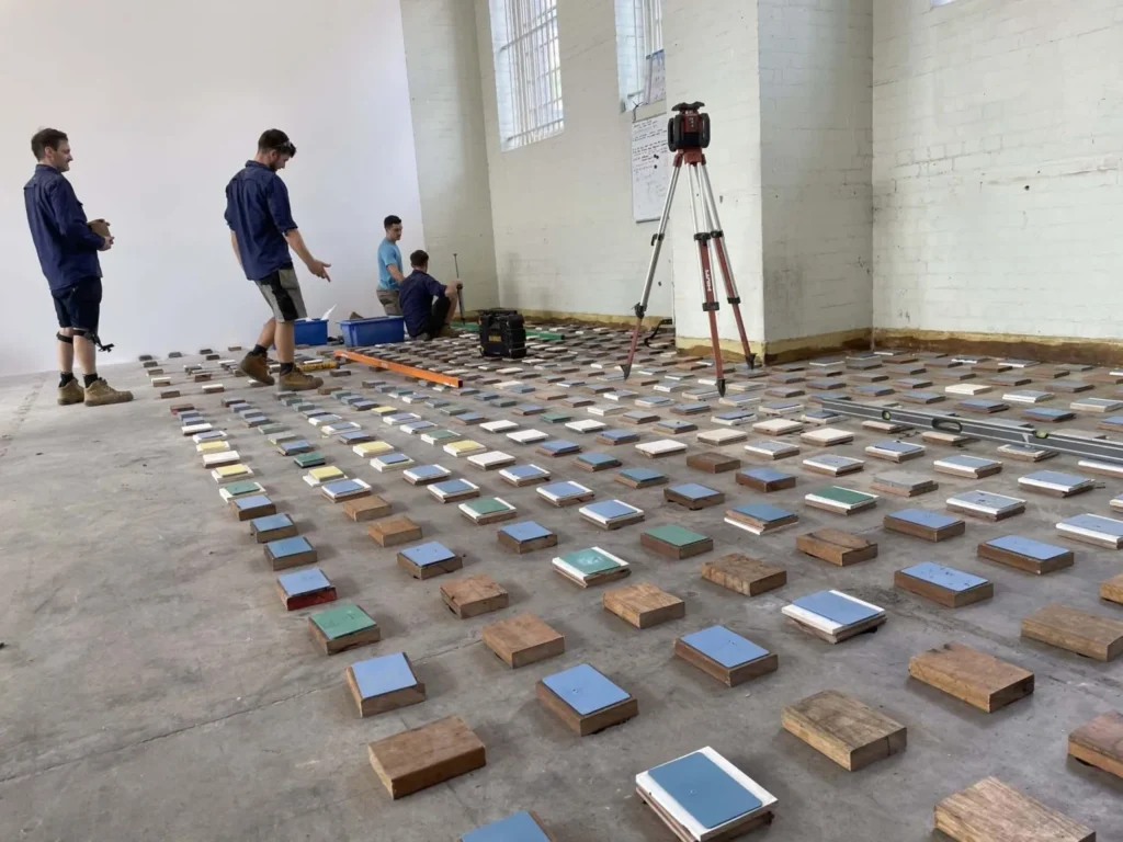 STM crew laying out EVA cushion pads for a floating sprung dance floor