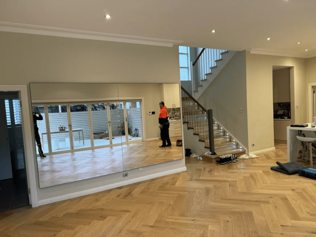 Two Mylar glassless mirror panels wall mounted in a home studio
