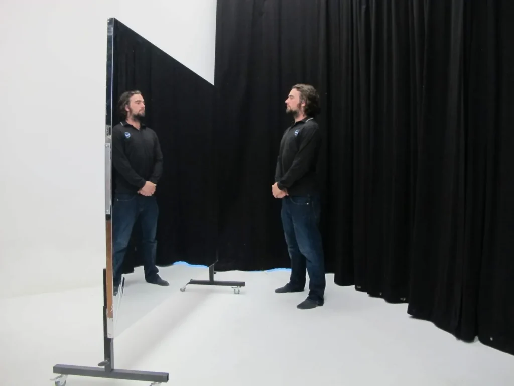 STM staff member reflected in a rollaway Mylar glassless mirror